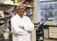 scientist in lab coat standing in a laboratory